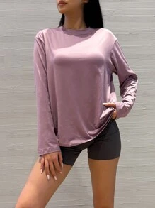 Lässiges, lose sitzendes einfarbiges schwarzes Langarm-T-Shirt mit kleinen Schulterausschnitten