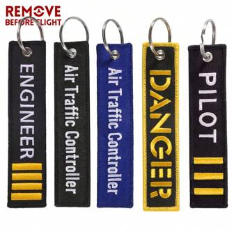 REMOVE BEFORE FLIGHT 1 pieza Llavero casual de poliéster con bordado de la letra "Remover antes del vuelo", accesorio de coche, dije para bolsa