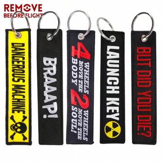 REMOVE BEFORE FLIGHT 1 pieza Llavero casual de poliéster (Dacron) con bordado de "QUITAR ANTES DE VUELO", accesorio para automóvil, colgante para bolso, escolar
