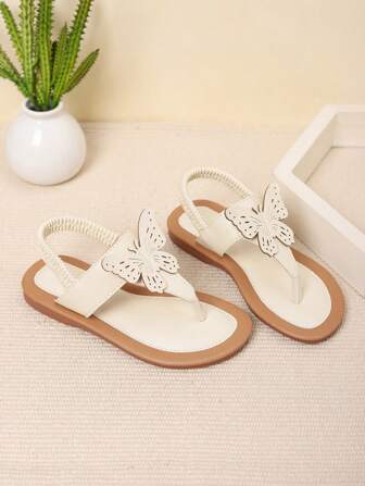 1 双女童蝴蝶结装饰 PU 防滑人字形时尚沙滩凉鞋，适合海滩