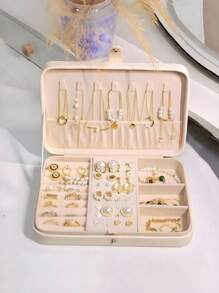 1 pieza Caja de almacenamiento de joyas de PU, organizador de joyas portátil de viaje, caja de almacenamiento de tocador, caja de exhibición de joyas de múltiples compartimentos, caja de regalo de almacenamiento, caja de exhibición, tapa abatible simple, gran capacidad, adecuado para guardar anillos, collares, aretes, relojes, labiales y otros accesorios, accesorios de dormitorio, suministros de viaje al aire libre, cierre con botón de seguridad, estilo internacional hermoso, adecuado para viajes y el hogar, regalo ideal para niñas