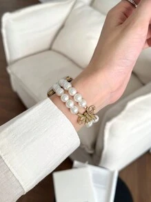 1 件女式白色金属时尚珍珠水钻蝴蝶结松紧带，适用于 38/40/41/44/45/49/42/46 毫米系列 11/SE3/Ultra3/Ultra/SE/SE2/10/9/8/7/6/5/4/3/2/1 - 白珍珠-金蝴蝶結 - 查看 6