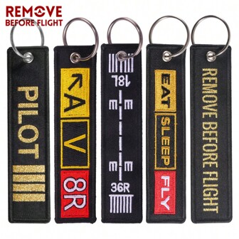 REMOVE BEFORE FLIGHT 1 pieza Llavero informal con letra, accesorio de coche con bordado de poliéster "Quitar antes de volar", accesorio para bolso, decoración escolar