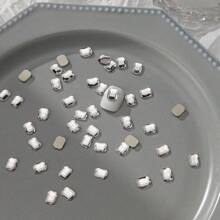 50 件/包美甲扁平不对称形状水钻装饰，包括白色闪光心形、蝴蝶形、星星形、水滴形、斜心形玻璃水钻美甲用品指甲饰品美甲宝石