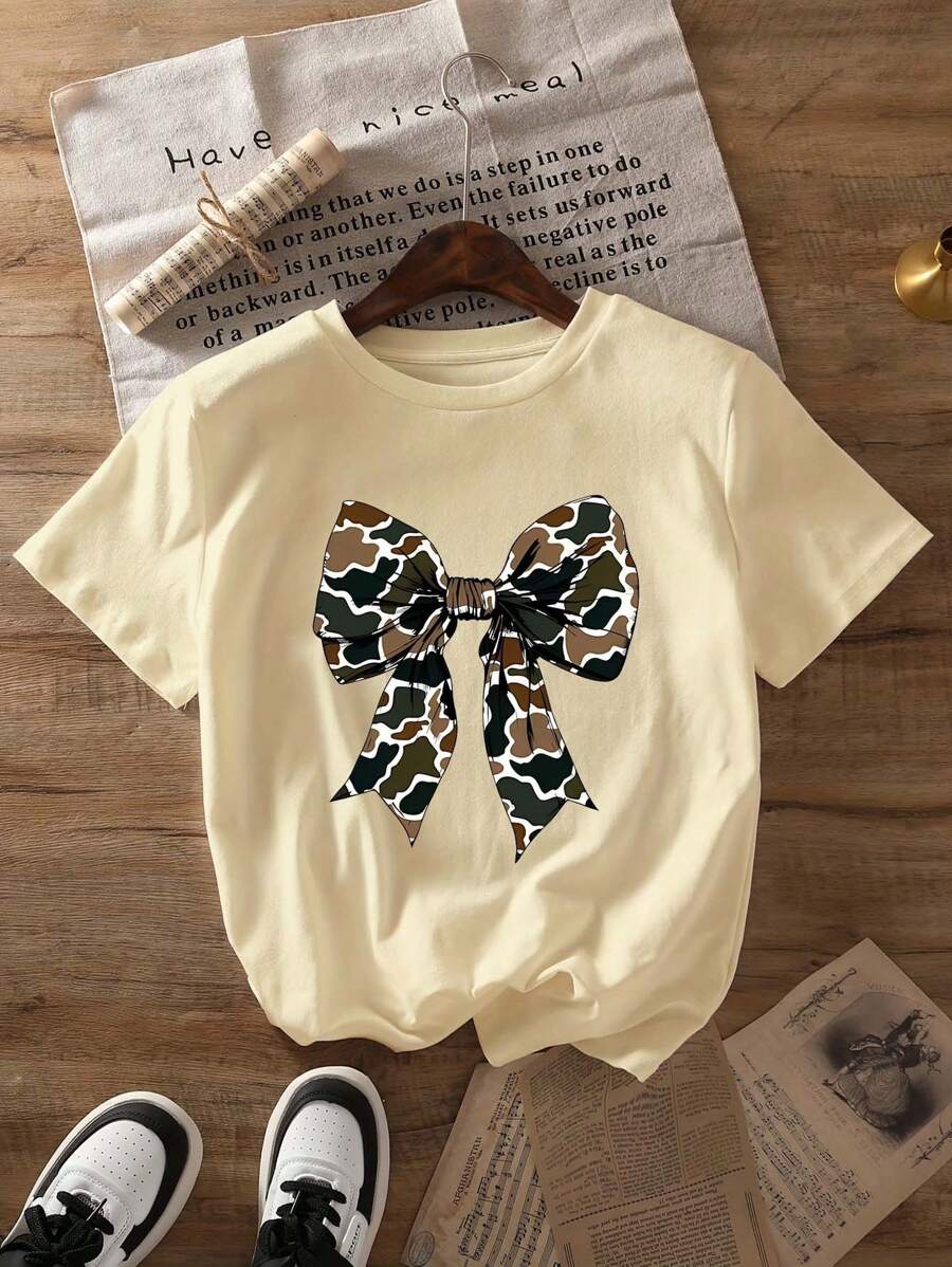 Camouflage Flirty Bow Graphic Print T-Shirt, Short Sleeve Crew Neck Casual Top For Summer & Spring, Women's Clothing - Màu be - Xem 1