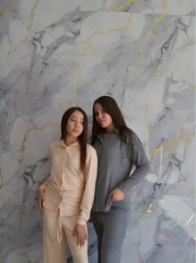 Set de 2 piezas de Chaqueta con botones frontales sólida y pantalones de pierna ancha tela acanalada con detalle de cordon frontal en cintura corte ligeramente holgado y camisa corte semi largo