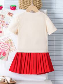 Set de 2 piezas para niña joven: Top de punto de manga corta con estampado de fresa y falda plisada. El dulce top de punto con estampado de fresa combinado con la clásica falda roja plisada crea un atuendo cómodo pero a la moda que resalta perfectamente la actitud juguetona de una niña pequeña. Apropiado para uso diario, reuniones con padres e hijos o sesiones de fotos de verano, haciendo que su pequeña sea el centro de atención. Talla para niñas de 4 a 7 años, primavera/verano. - Albaricoque - Ver 2
