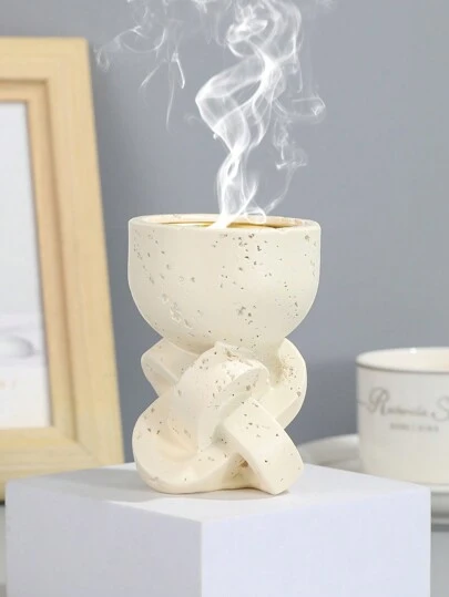 一款简约清新的树脂香炉。可用于家居装饰、办公室、节日和瑜伽场所，既可装饰又可芳香疗法。它还可以作为返校礼物、毕业礼物、赠品礼物、情人节礼物和女性礼物。