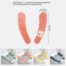 Four Toilet Seat Covers With Cute Fox Patterns In Different Colors (Blue, Orange, Yellow, And Green). They Are Soft, Fluffy, And Shaped To Fit The Toilet Seat. Each Cover Has A Small Fox Detail That Adds A Cute Touch. These Toilet Seat Covers Are Used For Comfort And Warmth, Especially In Cold Seasons.