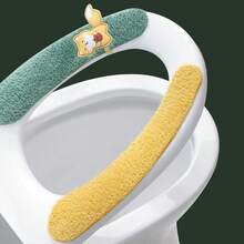 Four Toilet Seat Covers With Cute Fox Patterns In Different Colors (Blue, Orange, Yellow, And Green). They Are Soft, Fluffy, And Shaped To Fit The Toilet Seat. Each Cover Has A Small Fox Detail That Adds A Cute Touch. These Toilet Seat Covers Are Used For Comfort And Warmth, Especially In Cold Seasons.