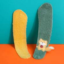 Four Toilet Seat Covers With Cute Fox Patterns In Different Colors (Blue, Orange, Yellow, And Green). They Are Soft, Fluffy, And Shaped To Fit The Toilet Seat. Each Cover Has A Small Fox Detail That Adds A Cute Touch. These Toilet Seat Covers Are Used For Comfort And Warmth, Especially In Cold Seasons.