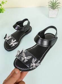 1双黑色幼儿/小女孩平底凉鞋，饰有闪亮珍珠和蝴蝶图案，透明PU鞋带，魔术贴搭扣，圆头设计，柔软防滑鞋底，可爱波西米亚公主风沙滩鞋，适合3-12岁女孩，日常、派对、海滩、上学等场合穿着，2026春夏款。 - 黑色 - 查看 2