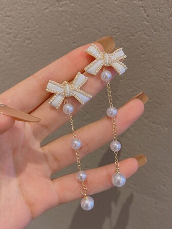 1 对时尚蝴蝶结珍珠流苏长款吊坠耳环，甜美优雅，适合女性