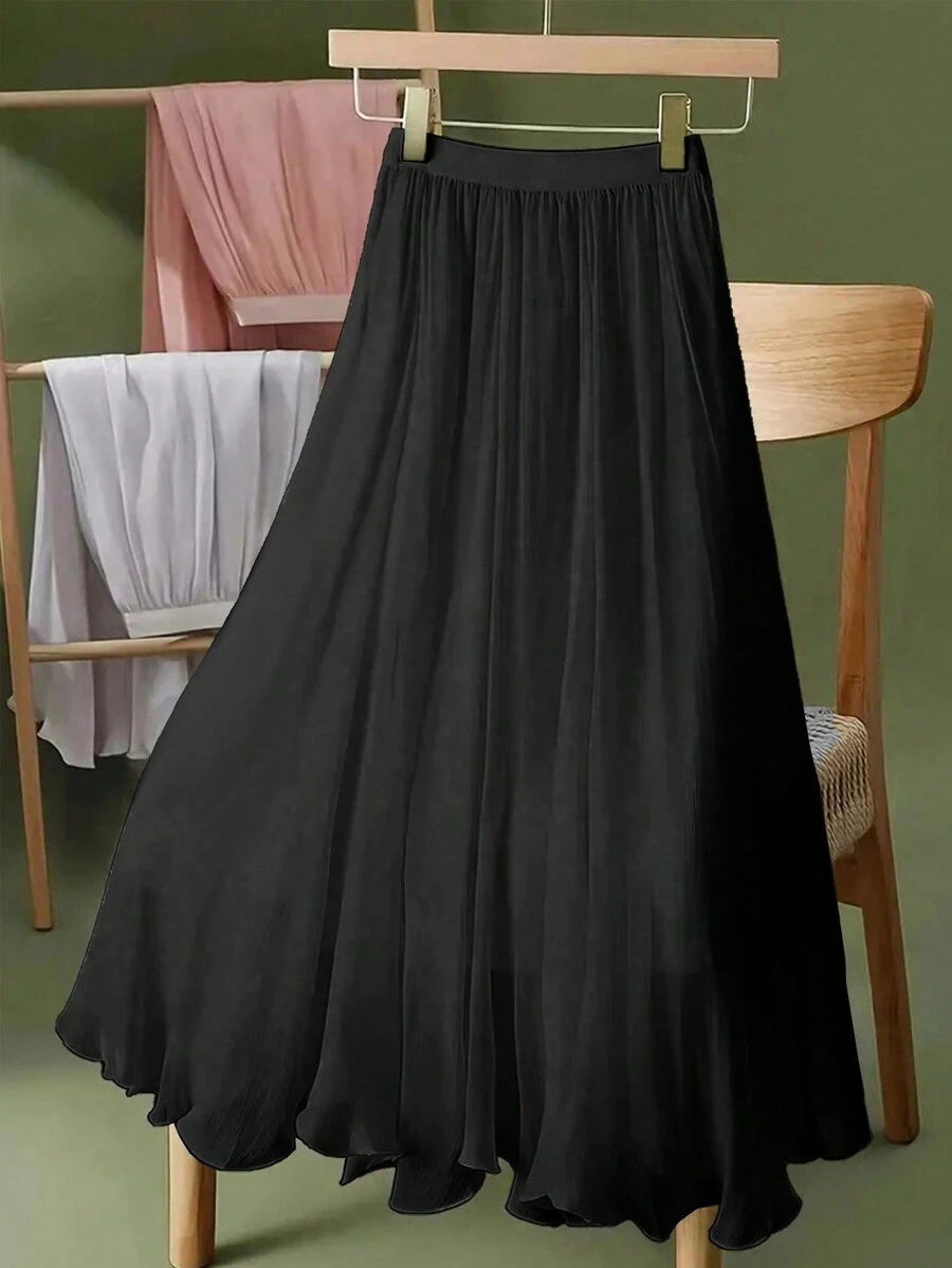 Chân váy chữ A dài ngang gối bằng chiffon màu trơn, cạp chun co giãn, có lớp lót, kiểu dáng thanh lịch, tôn dáng, phù hợp cho mùa xuân/hè, đi làm, đi nghỉ mát. Màu đen.