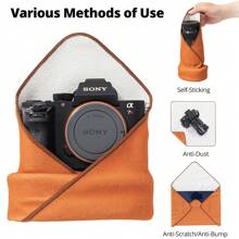 1 pièce Tissu pliable adhésif magique de 45 cm / 17,7 pouces avec 100 autocollants d'appareil photo. Doublure de sac pour caméra micro-simple, iPad, appareil photo reflex