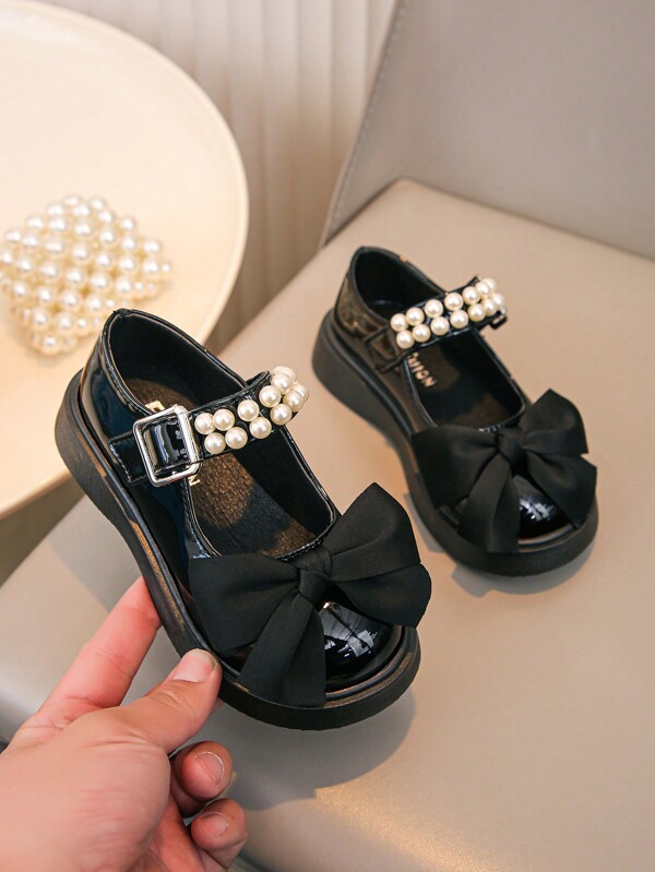 Mädchen glänzende schwarze Schleifen Dekor Mode niedliche flache Loferschuhe, weich und bequem