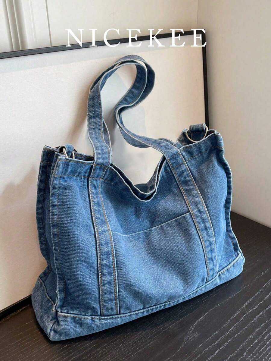 街头时尚新款牛仔布手提包，简约纯色单肩包，复古休闲可调节肩带斜挎包，适合工作、通勤、购物和大学生使用。