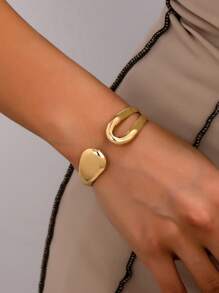1 件简约优雅高品质小众设计不对称镂空水滴金色金属袖口手链，适合正式场合、派对、日常穿着、办公室、酒吧、音乐节、街头风格、摄影、婚礼、商务活动，是送给朋友和家人的绝佳礼物 - 金黃色 - 查看 2