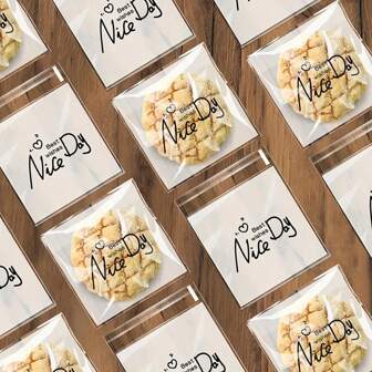 100 个/包自粘式透明塑料礼品袋，印有“祝你有美好的一天”和“快乐”图案 - 适用于各种尺寸的饼干、糖果、零食 - 多用途派对礼品、包装和装饰包装袋