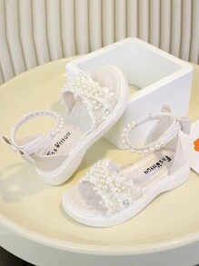 Buty antypoślizgowe z miękkiej gumy dla małych dzieci, zdobione perłowymi kryształkami, modny i prosty design, beżowe i czarne, odpowiednie na zewnątrz, w podróż, na plażę i do domu