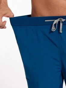 Conjunto de pijama médico para hombres con parte superior de manga corta multicolor + pantalón tipo jogger, uniforme de enfermería, veterinaria y trabajo