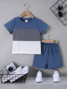 Conjunto de 2 piezas de camiseta de manga corta y shorts de color liso acolchado, suave y cómodo, con textura de gofre, para niño, para uso casual/al aire libre, primavera/verano - Azul - Ver 1