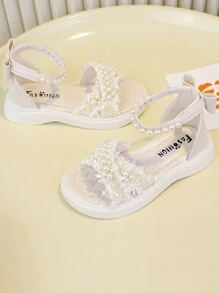 Buty antypoślizgowe z miękkiej gumy dla małych dzieci, zdobione perłowymi kryształkami, modny i prosty design, beżowe i czarne, odpowiednie na zewnątrz, w podróż, na plażę i do domu