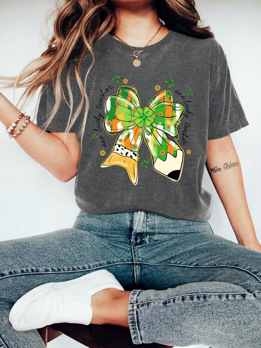 Teacher St. Patrick Bow Pencil Cartoon Letter Graphic Print T Shirt, Short Sleeve Crew Neck Casual Top For Summer & Spring, Women's T-Shirt
