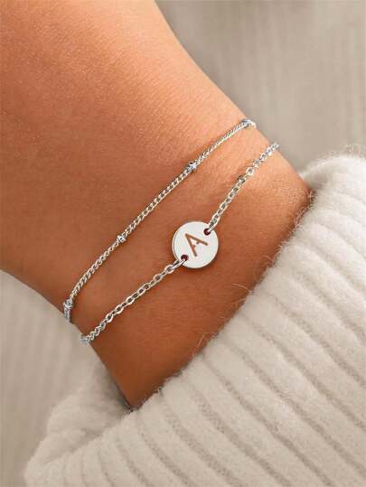 2pcs/Set Teenager Stainless Steel Hollow 26 Letter Disc Pendant & Bead Bracelet Set, Elegant Fashion Jewelry For Daily Wear, Gift For Friends And Students