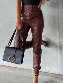 Eleganckie plisowane brązowe skórzane obcisłe spodnie damskie