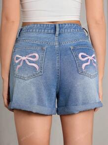 Short en jean d'été pour femmes, style bohème décontracté et mignon, avec ourlet roulé et broderie en forme de nœud papillon