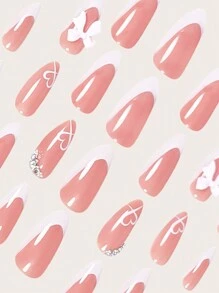 Exprimez votre amour avec 24 faux ongles en forme d'amande pour la Saint-Valentin. Style français blanc élégant simple avec cristaux 3D, nœuds roses. Faux ongles roses en forme de cœur mignon pour la Saint-Valentin et la Fête des Mères. Kit complet de faux ongles pour femmes et filles, comprend un salon de manucure avec 1 pièce de gel jelly et 1 lime. Expédition aléatoire du gel jelly.