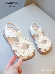 新款女童幼儿凉鞋可爱蝴蝶结镂空花卉图案软底防滑小孩鞋，适合夏季 - 米色 - 查看 4