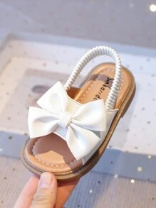 Nuevas sandalias planas para niñas con diseño minimalista de lazo, suela blanda antideslizante, para niños pequeños y bebés. Versátiles para uso casual diario en verano