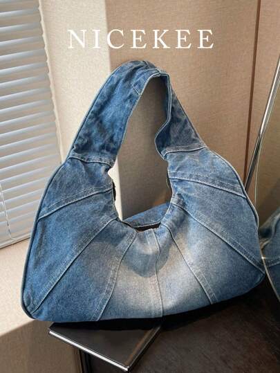 新款女士单肩包，新月形牛皮牛仔布手提包，大容量斜挎包，适合工作和休闲场合。简约设计，顺滑拉链，背负舒适，内部空间宽敞，完美契合春夏时尚，是牛仔女孩的理想之选。