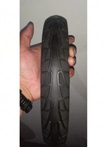 LLANTA SOLIDA (ANTIPONCHADURAS) 14X2.125 PARA BICICLETA ELÉCTRICA, NO NECESITA CAMARA NI PIVOTE Y JAMAS SE VA A PONCHAREXCELENTE CALIDAD CON ORIFICIOS INTERMEDIOS QUE DISMINUYEN LA VIBRACION Y AUMENTAN SU TIEMPO DE VIDA - Negro - Ver 3