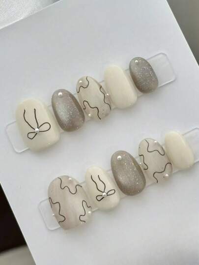 10 Pieces Of Oval Handmade Nail Tips, Short Nails, Champagne Nails, Cat Eye Nails, Polka Dots, Hand-Painted Bows, Three-Dimensional Pearl Decorations, Cute Style Nails, Spring, Summer, Autumn And Winter Press-On False Nails Full Cover Nail Tips, Four Seasons Nails Home Diy Nails, Different Sizes Are Available, Suitable For Parties, Dances And Daily Wear. Comes With A Nail Art Kit, The Best Gift For Women Nail Supplies Nails