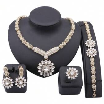Juego de joyería de lujo con tono dorado y cristal en forma de flor para mujeres - Collar, pulsera, aretes y anillo, set de 4 piezas como accesorio para fiesta, boda y eventos