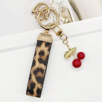 TTOBS 1pc Exquisitely Crafted Leopard Print Leather Car Key Chain With Adorable Cherry Pendant - , Fashionable And Multi-Functional Backpack Keychain - The Perfect Accessory For Backpacks. The Perfect Valentine's Day Gift, Also An Ideal Gift For Your Beloved Girlfriend.