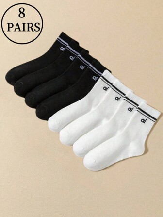 8 pares de calcetines negros y blancos para niños y niñas con las letras "Al" en franjas paralelas, modelos básicos simples y versátiles para el ocio y la vida diaria, y calcetines cómodos, transpirables y de alta elasticidad, agradables a la piel.