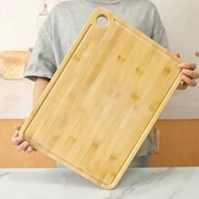 Une planche à découper en bambou, planche à découper de fruits rainurée épaissie de cuisine verticale, planche à découper en bambou d'ustensiles de cuisine ménagers