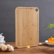 Une planche à découper en bambou, planche à découper de fruits rainurée épaissie de cuisine verticale, planche à découper en bambou d'ustensiles de cuisine ménagers