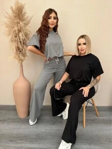 Set 2 piezas acanalado de blusa holgada con cordón en frente hombros caídos y pantalón acampanado con bolsas laterales y cordón en pretina de cintura tela fresca