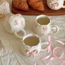 1pc Creative 3D Embossed Hand-Painted Bow Pattern Ceramic Coffee Mug With Ribbon, Gift Packaging Back To School