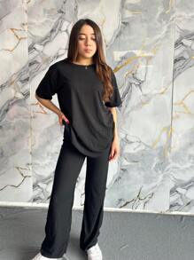 Conjunto informal rojo de dos piezas para mujer, camiseta de media manga con cuello redondo y pantalón largo con tejido ligeramente elástico. - Negro - Ver 2