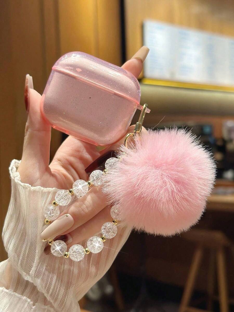带毛球吊饰的闪光耳机盒，简约时尚，适合日常休闲使用