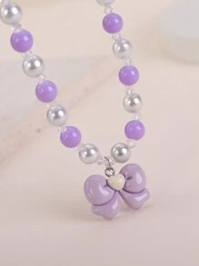 2 件套儿童紫色蝴蝶结串珠项链和手链套装