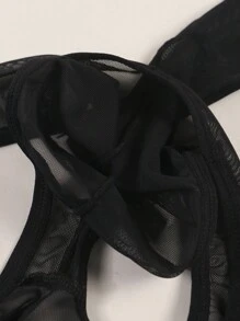 Herren schwarze sexy Mesh-Unterwäsche, halbtransparent mit süßem Herz-Augen-Druckmuster, atmungsaktiv und bequem als Alltagsunterwäsche Tangas