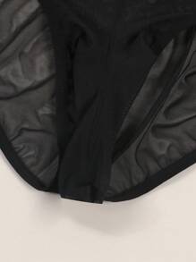 Herren schwarze sexy Mesh-Unterwäsche, halbtransparent mit süßem Herz-Augen-Druckmuster, atmungsaktiv und bequem als Alltagsunterwäsche Tangas