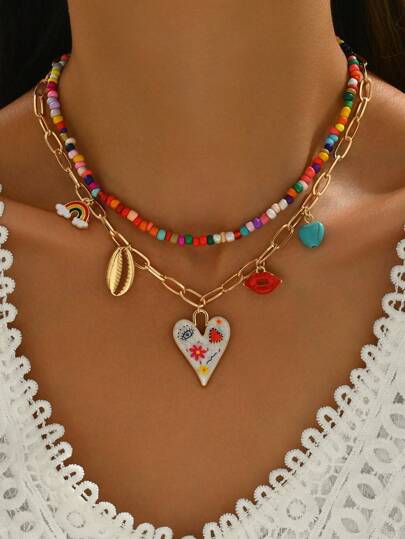 Set de 2 piezas de joyería divertida que incluye colgantes de corazón pintado de colores, labios rojos, concha, corazón arcoíris y turquesa verde con cadenas de cuentas de colores variados, adecuado para mujer para uso diario, estilo callejero, fiestas, vacaciones, festivales de música, los colores de las cadenas de cuentas son aleatorios.